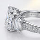Close macro view highlighting the baguette setting, under-gallery, and triple row pave shank of a luxury moissanite proposal ring.