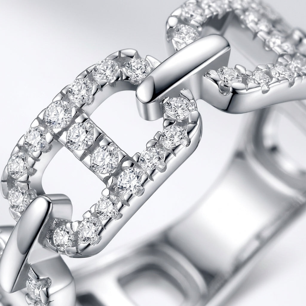 Micro profile close-up on the pave moissanite mariner links, interlocking silver joins, and mirror-polished surface finish.