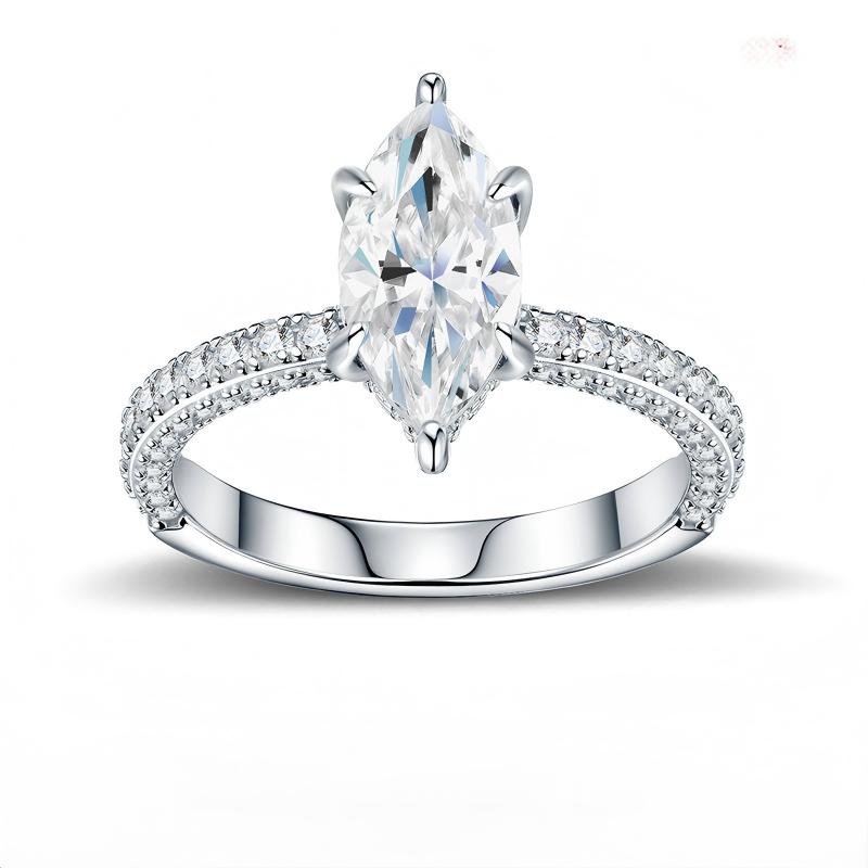 Marquise cut moissanite solitaire engagement ring with multi-row pave band on white background.