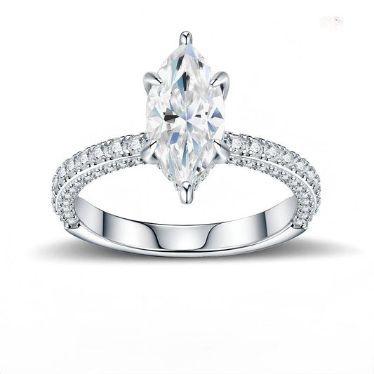Marquise cut moissanite solitaire engagement ring with multi-row pave band on white background.