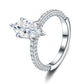 Angled view of marquise cut moissanite engagement ring showing multi-row pave band sparkle.