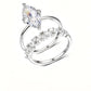 Marquise cut moissanite solitaire and crown stacking ring set in platinum plated silver.