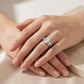 Model showing marquise cut moissanite three stone bridal ring set on hand.