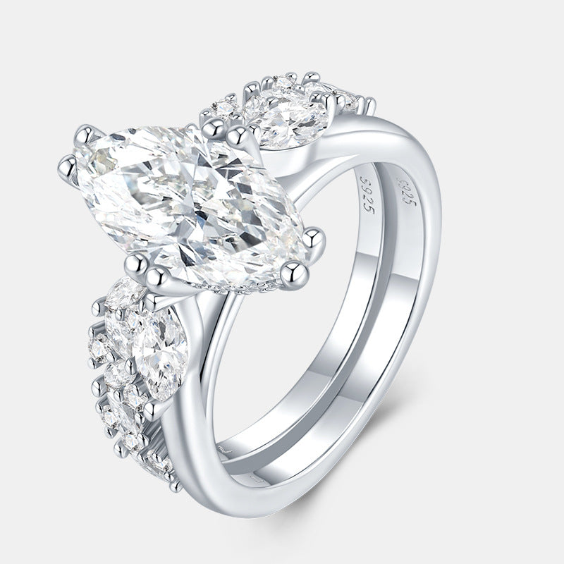 Side profile view showing interlocking 2-piece marquise moissanite bridal ring set.