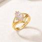 Perspective view of gold marquise moissanite solitaire and wishbone chevron band.