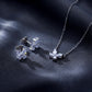 Marquise and pear lab diamond butterfly pendant necklace and matching stud earrings on dark satin.