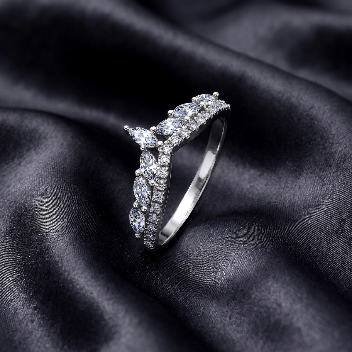 Angled side profile of lab grown diamond curved wishbone wedding band on black silk fabric