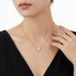 Minimalist gold east-west oval bezel necklace paired with black top, ideal gift for her