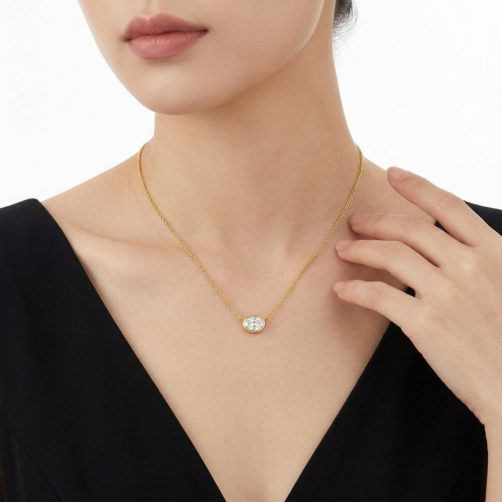Minimalist gold east-west oval bezel necklace paired with black top, ideal gift for her
