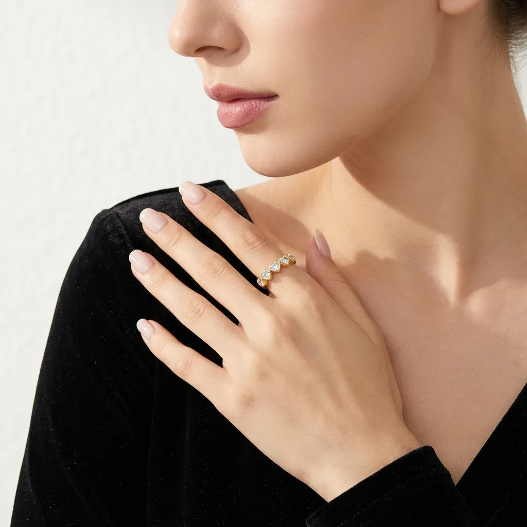 High-end fashion lookbook view of a model wearing a minimalist romantic heart shaped statement jewelry ring for luxury gifting ideas.