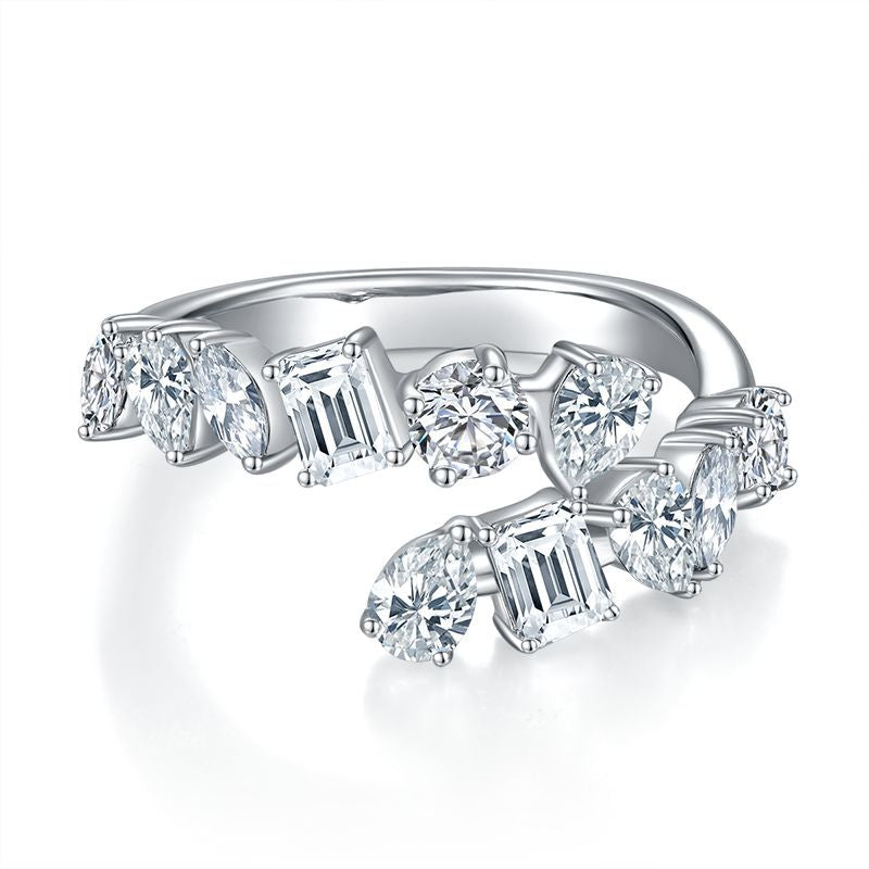Front view showing pear, emerald, and marquise cut moissanites on open bypass band.