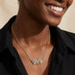 Woman wearing Kendra Scott checkered flag silver necklace 