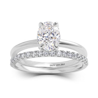 Modern 1.26ct oval cut lab diamond stacking bridal wedding ring set in 925 sterling silver.