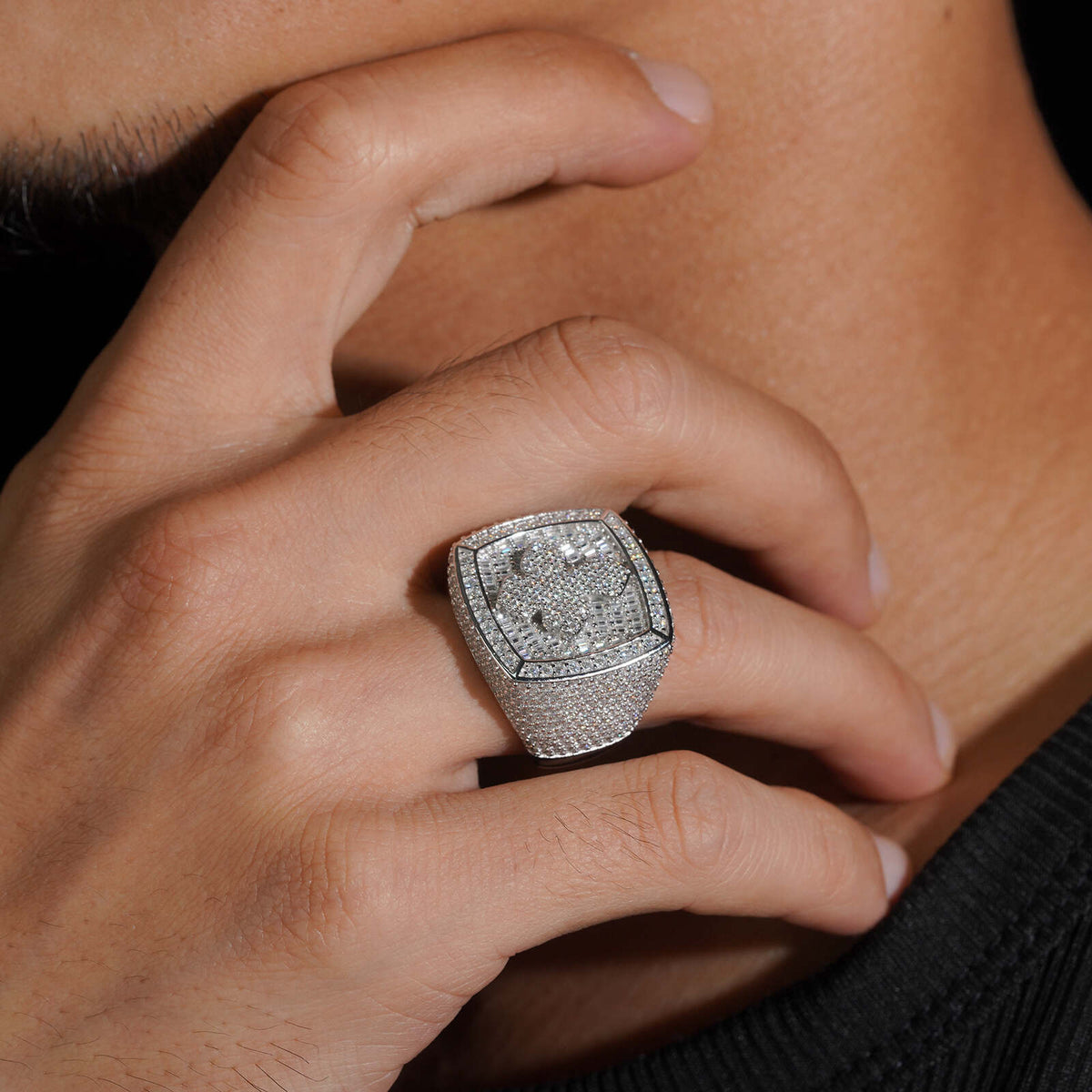Model wearing S925 sterling silver iced out moissanite baguette cushion cross ring touching neck   