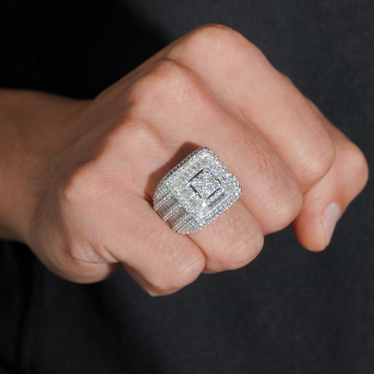 Model wearing S925 sterling silver iced out moissanite baguette square signet ring on finger