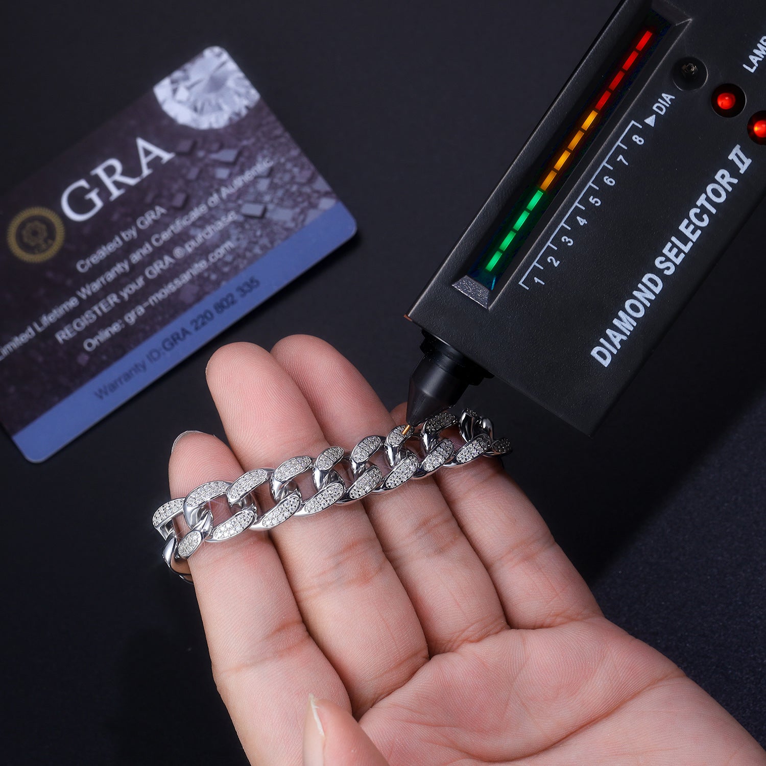 12mm moissanite Cuban link bracelet passing a diamond tester, proving authentic heat conductivity and gemstone quality.