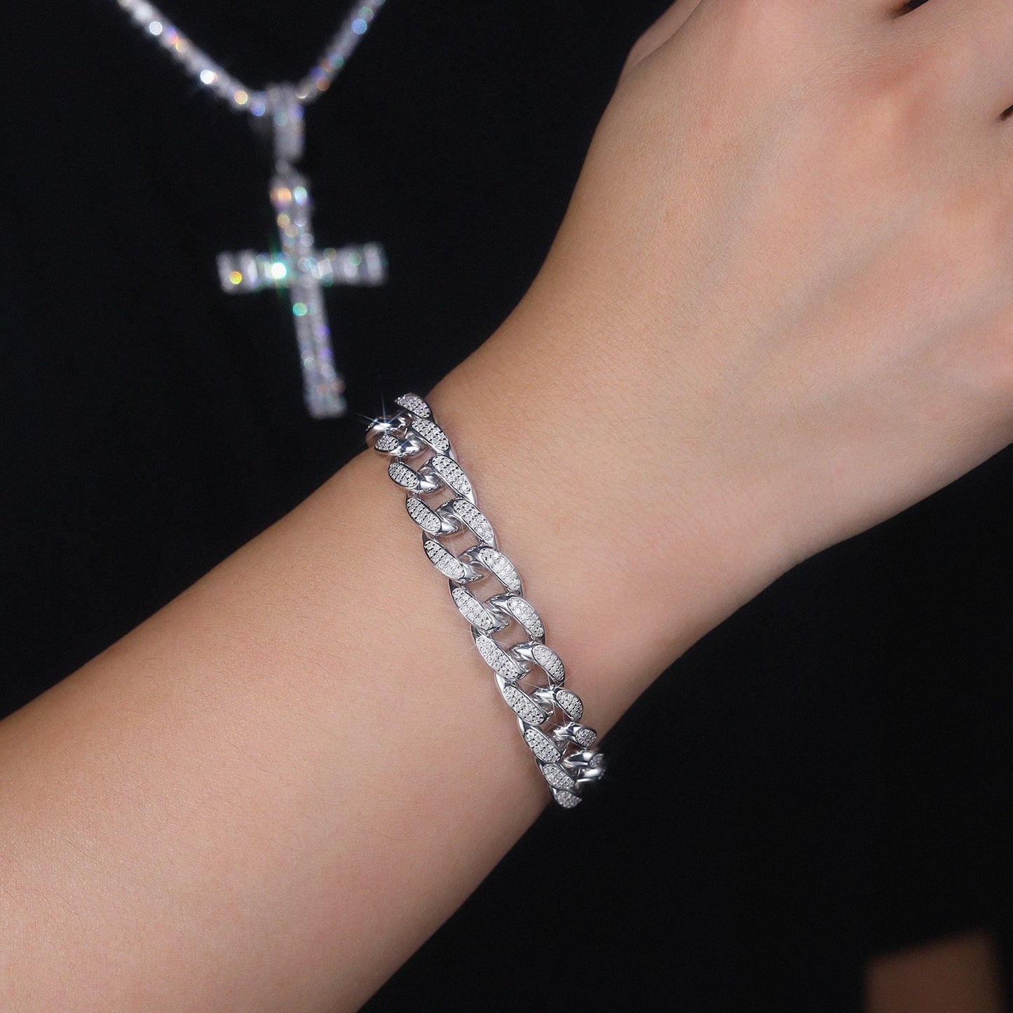 Close-up shot of a 12mm iced out moissanite Cuban bracelet worn on a male wrist, showcasing luxury fit and daily style.