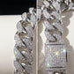 Macro detail of 12mm moissanite stones on a Cuban link chain, highlighting the rainbow fire and VVS clarity sparkling stones