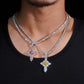 Model wearing layered S925 silver moissanite floral cluster cross pendant necklaces with tennis chains