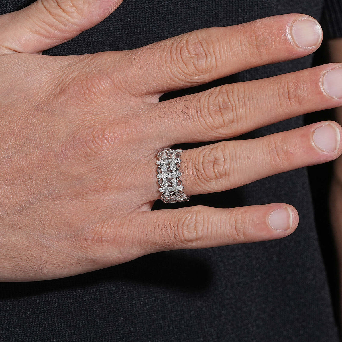 Model wearing S925 sterling silver moissanite gothic cemetery cross band ring on finger