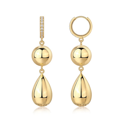 Gold pavé moissanite huggie hoop earrings with tiered sphere and teardrop dangle charms on white background.