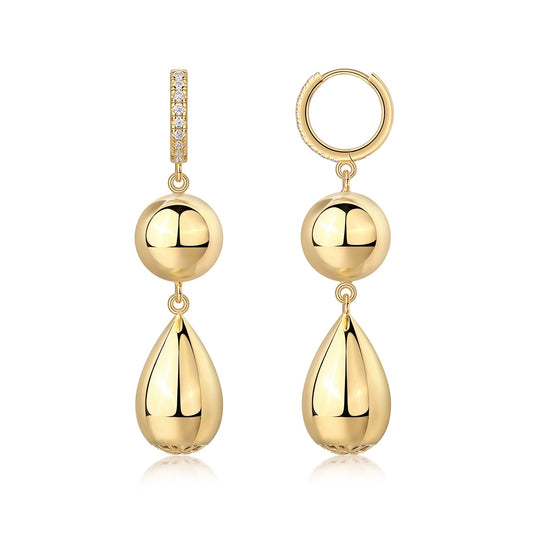 Gold pavé moissanite huggie hoop earrings with tiered sphere and teardrop dangle charms on white background.