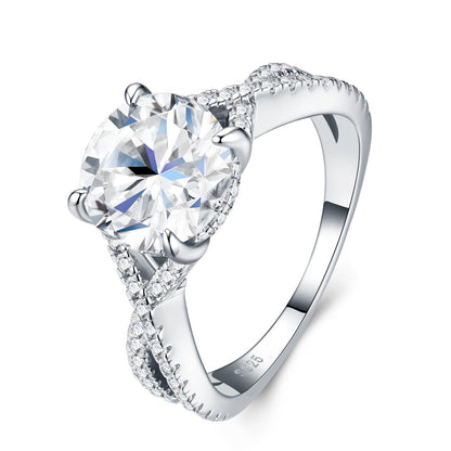 Angled product shot of moissanite twisted vine ring on white background, highlighting the micropavé diamond-like band.