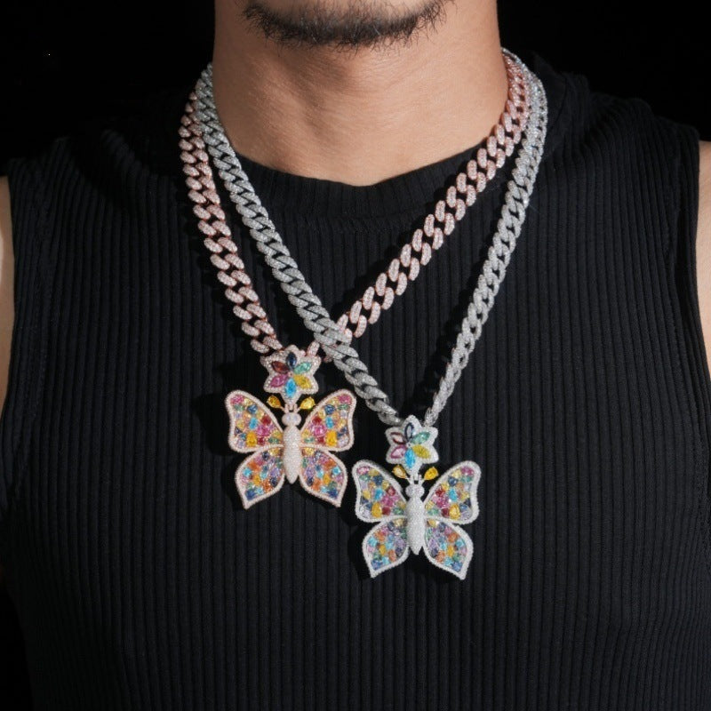 Model wearing layered S925 silver multi-color moissanite butterfly pendant necklaces with cuban chains