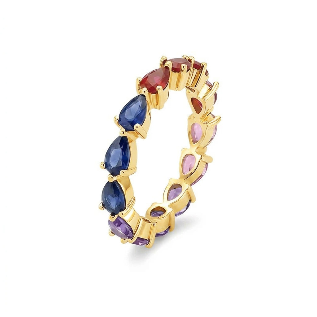 Gold multi-color pear cut rainbow eternity band ring with multi-colored gemstones on white studio background