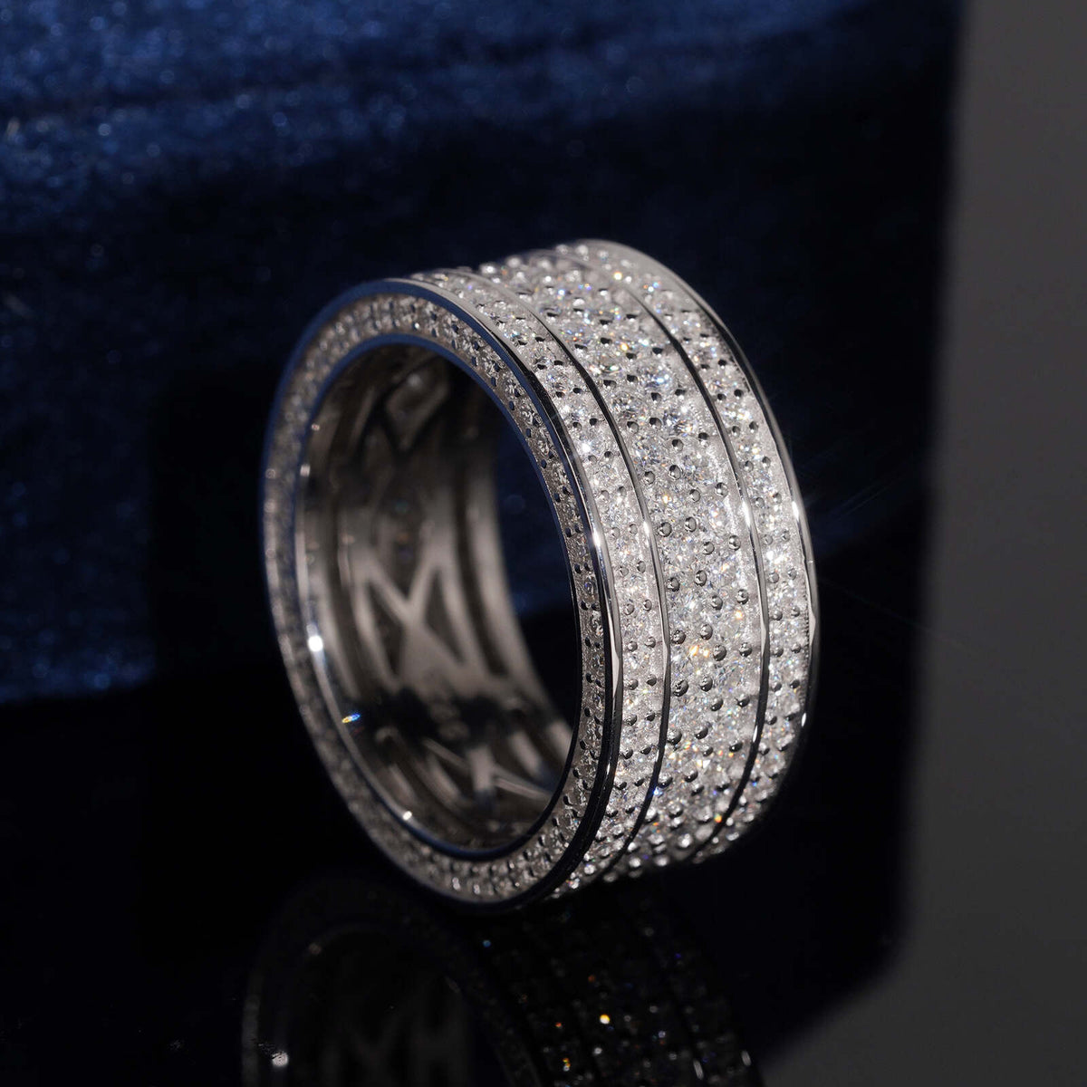 Angled view showing inner hollow pattern of multi row micro pave moissanite wide ring