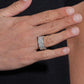 Person wearing multi row micro pave moissanite wide eternity band ring on finger