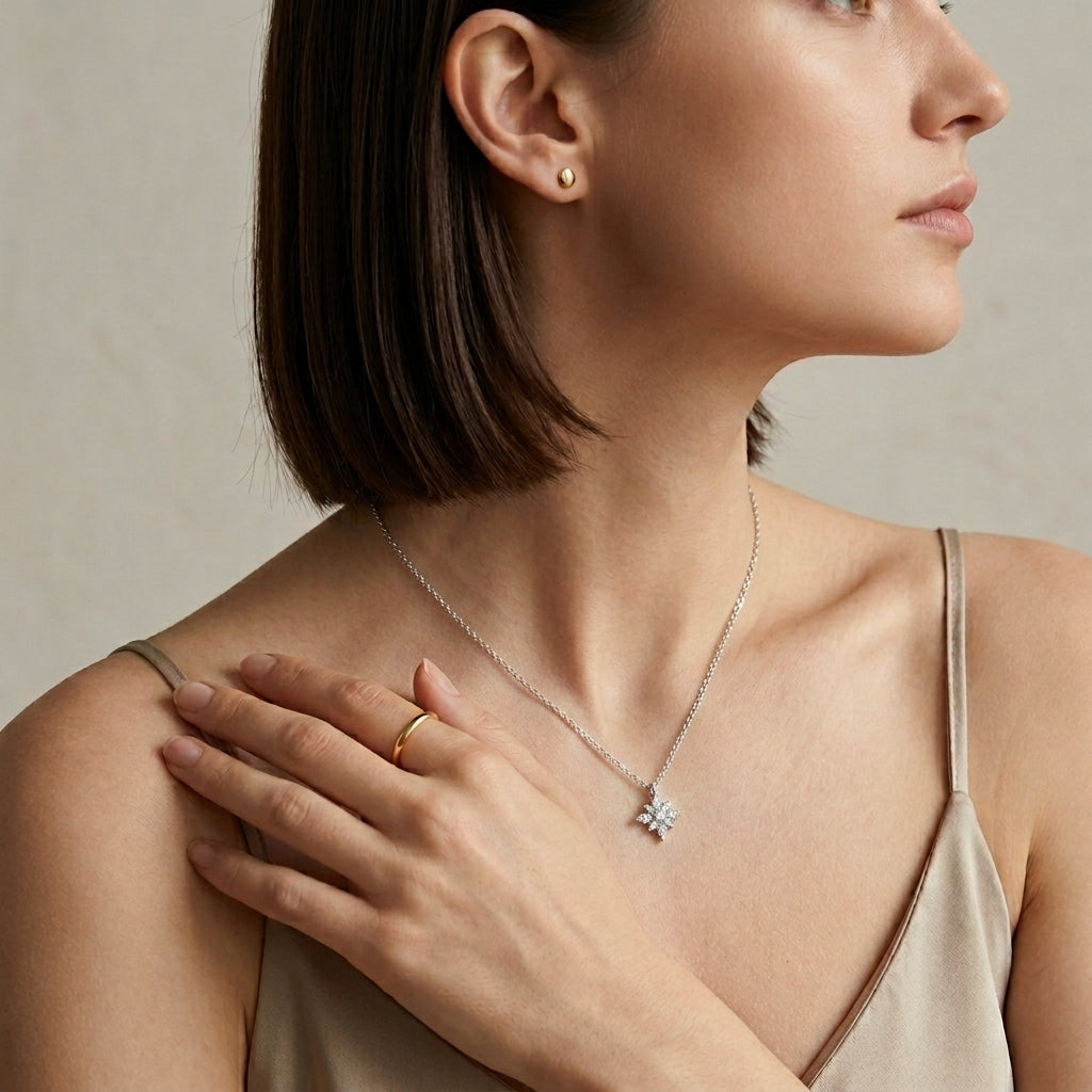 Model wearing multi-shape moissanite compass star solitaire pendant necklace.