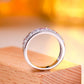 Inside band view showing smooth inner surface of multicolor gemstone and moissanite wide ring