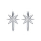 North star moissanite huggie hoop earrings with celestial starburst pave setting on white background.