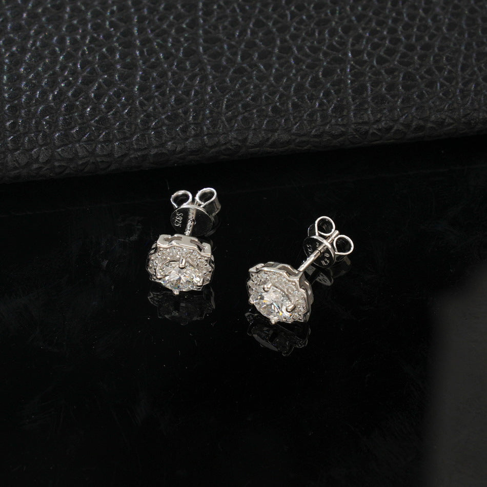 Angle view of octagonal scalloped halo lab diamond stud earrings showing posts and butterfly backings.