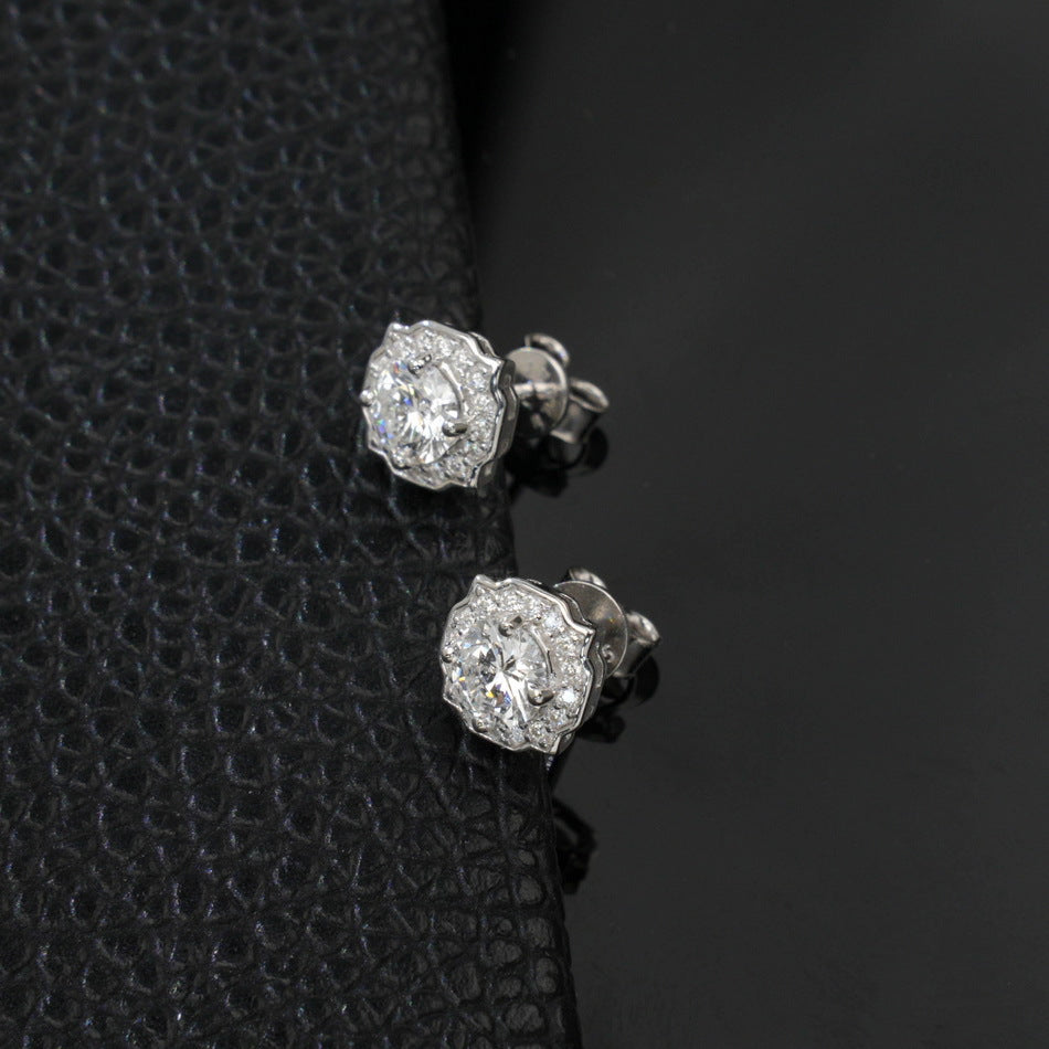Side profile perspective view of vintage octagonal scalloped halo lab diamond stud earrings.