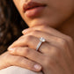 Fine jewelry lifestyle shot highlighting an old money aesthetic brilliant sparkle statement bridal jewelry ring on a model's hand.