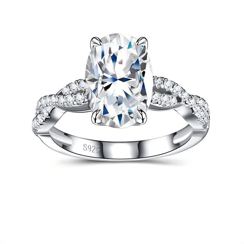 Oval cut moissanite engagement ring with pave twisted vine infinity band on white background.