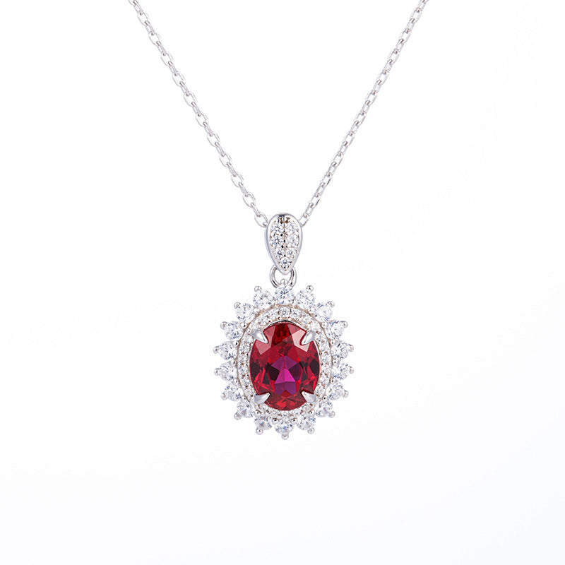 2ct oval-cut ruby Diana halo pendant necklace on fine silver chain link