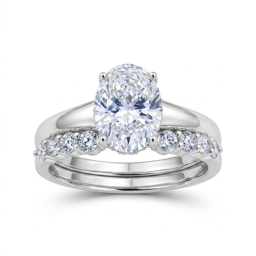 Oval lab grown diamond engagement ring and curved accent wedding band set in 925 silver.