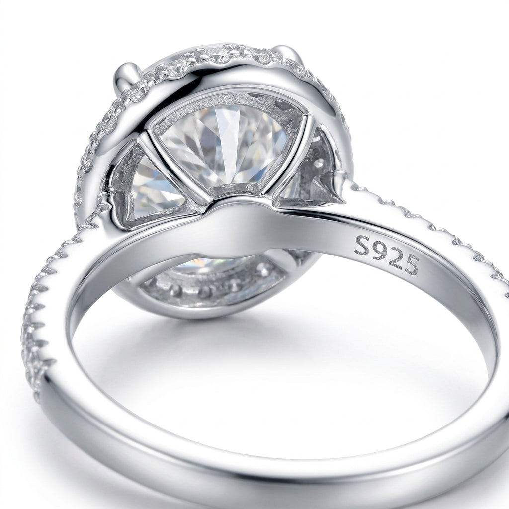 Macro close-up showing basket undergallery and S925 hallmark on silver oval moissanite halo ring.
