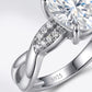 Macro close-up view showing pave strand and polished strand twist detail on silver moissanite ring.
