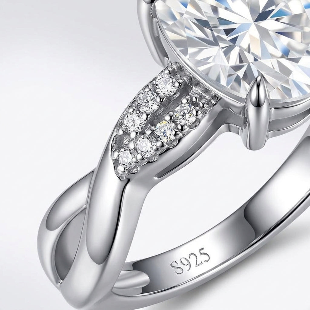 Macro close-up view showing pave strand and polished strand twist detail on silver moissanite ring.