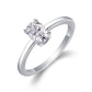 Silver oval moissanite solitaire ring with polished plain band standing on display.