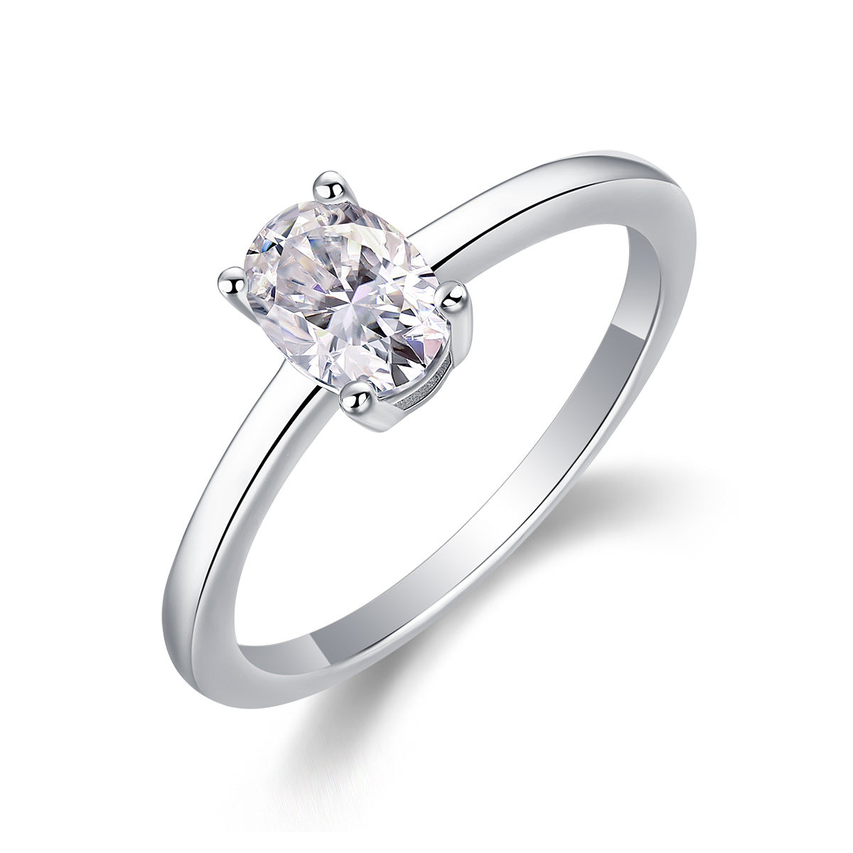 Silver oval moissanite solitaire ring with polished plain band standing on display.