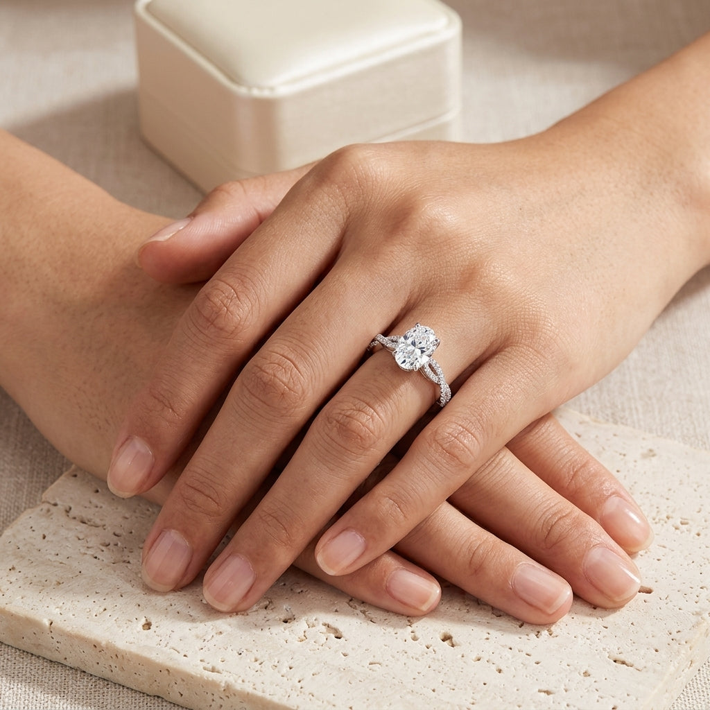 Model showing oval cut moissanite twisted vine infinity ring on hand.