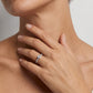 Lifestyle view of model displaying oval cut lab grown diamond pave band solitaire ring.