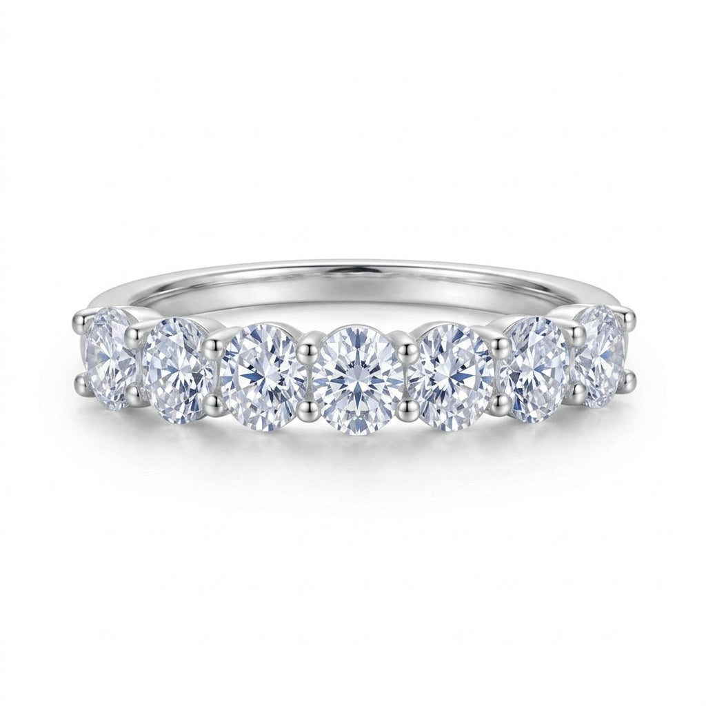 Front view of oval seven-stone shared-prong stacking band ring.