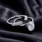 Oval solitaire engagement ring and matching curved pave wedding band shown separated on dark silk.