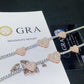 Pave heart moissanite tennis bracelets laid flat across GRA report papers